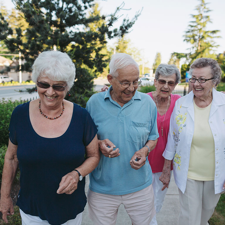 Anglicare Minto Gardens - happy group of seniors out for a walk